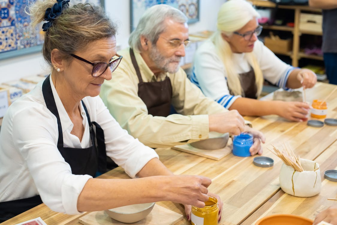 Seniors trying new things as an adult through a beginner pottery class.