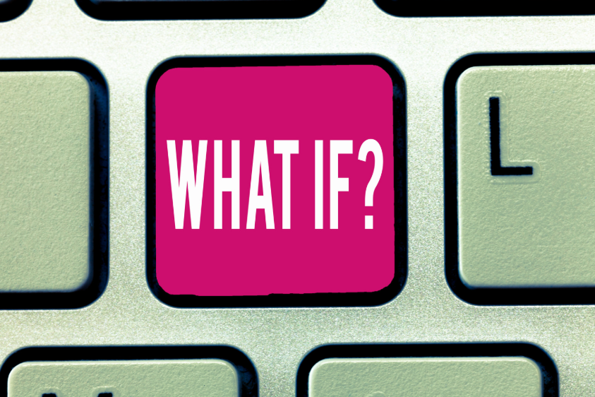 Keyboard key labeled what if to show what-if scenarios for decisions and clearer thinking.